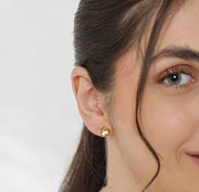 Soft blush morganite stud earrings radiating feminine charm and subtle sparkle.